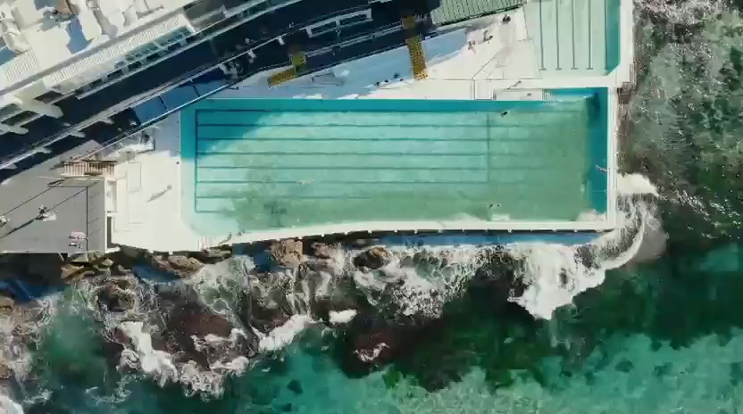 Aerial view of Bondi Icebergs and the rocky coastline from the tour film